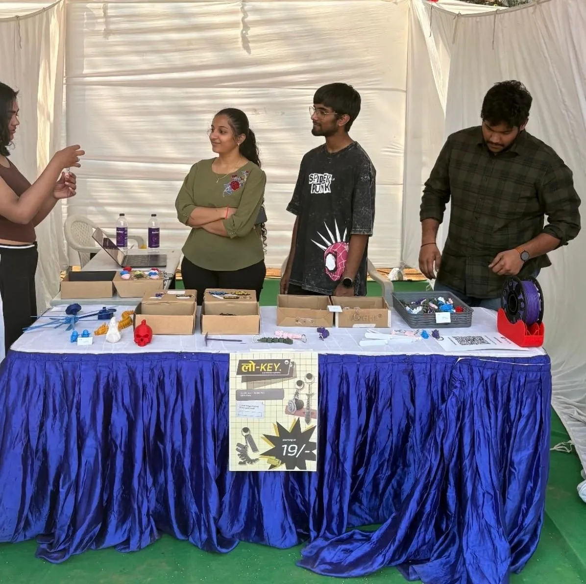 The team at the stall, poster on the table front
