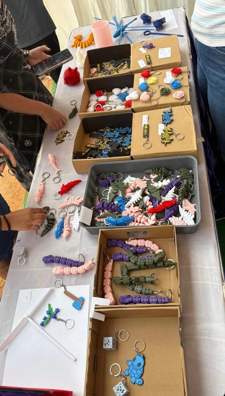 Designs grouped in open boxes along one table