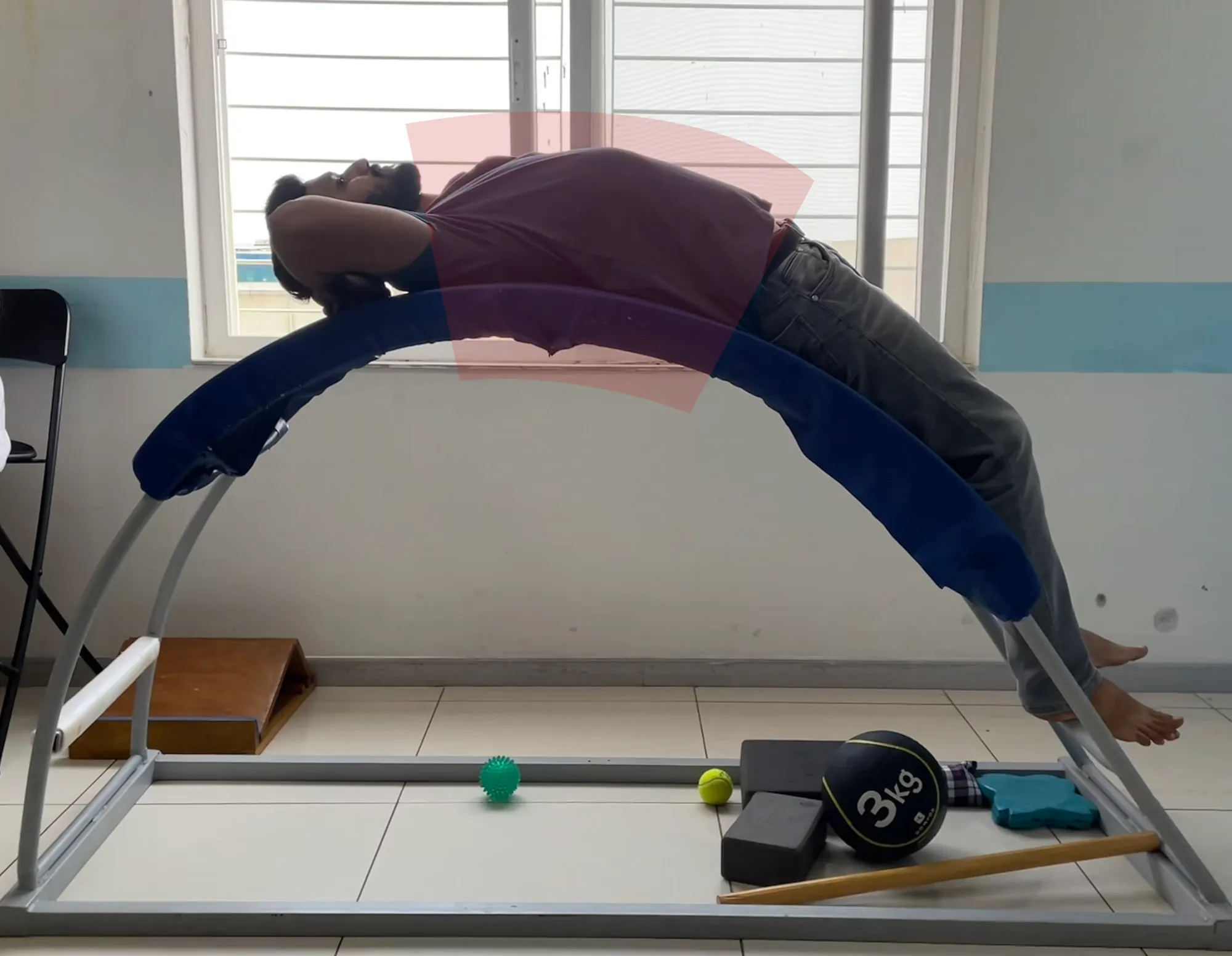 fig 1.2 - Shows how to use the POC. The red highlight marks the part of the spine being stretched
